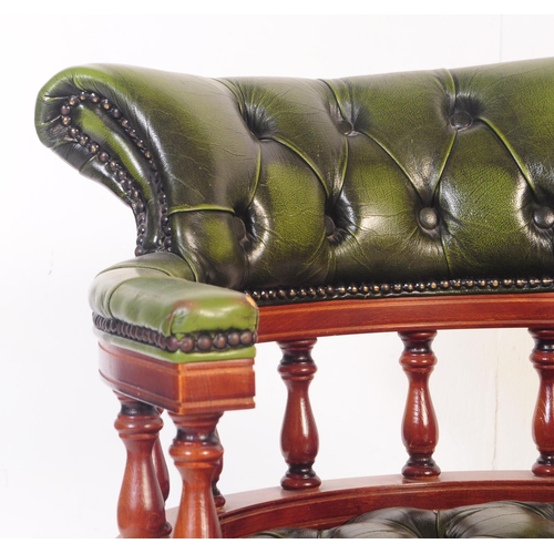 799 - A  Chesterfield style green leather captain's office swivel desk armchair. The chair having button b... 