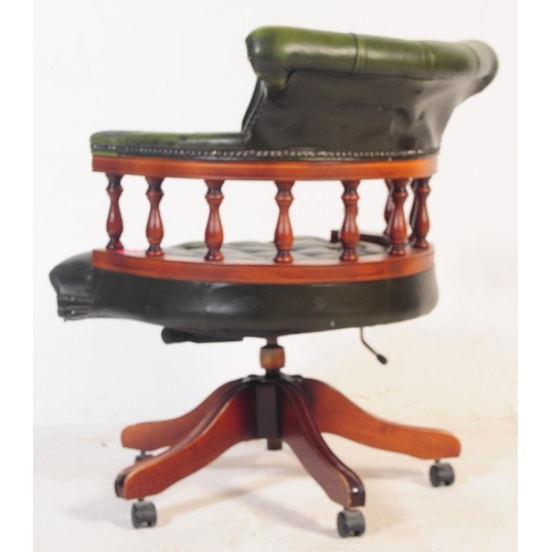 799 - A  Chesterfield style green leather captain's office swivel desk armchair. The chair having button b... 