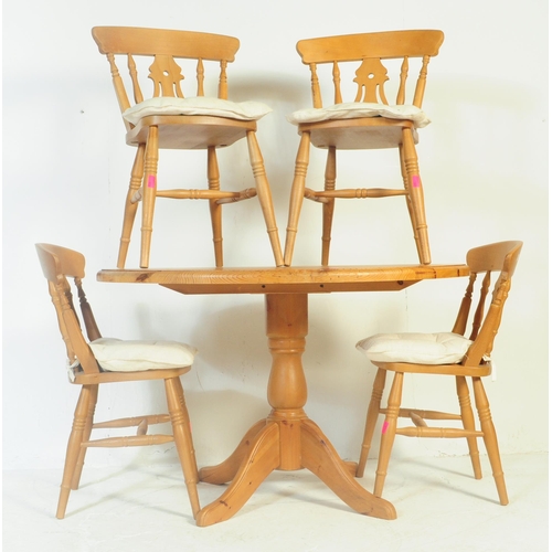 843 - A contemporary country pine revival pedestal dining room table together with a set of dining chairs.... 