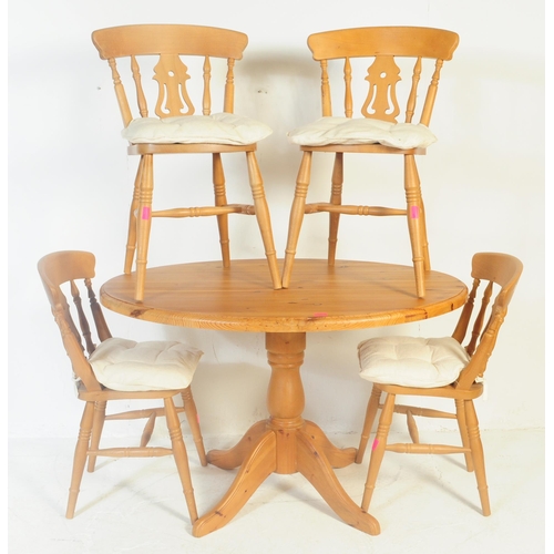 843 - A contemporary country pine revival pedestal dining room table together with a set of dining chairs.... 