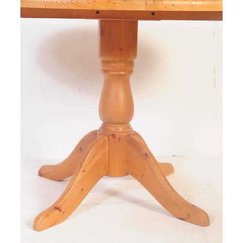 843 - A contemporary country pine revival pedestal dining room table together with a set of dining chairs.... 