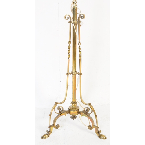 946 - A 19th century Victorian converted brass standard lamp. The lamp with hoof feet to splayed legs with... 