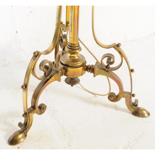 946 - A 19th century Victorian converted brass standard lamp. The lamp with hoof feet to splayed legs with... 