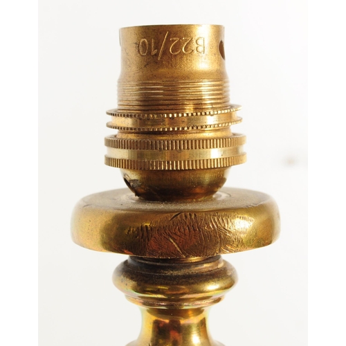 946 - A 19th century Victorian converted brass standard lamp. The lamp with hoof feet to splayed legs with... 