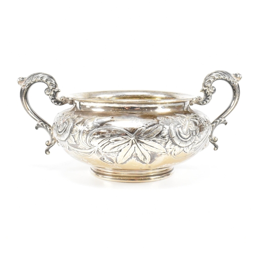 10 - A Georgian hallmarked silver sugar bowl. The George IV bowl having a circular plinth raising to a bu... 