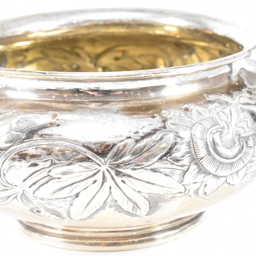 10 - A Georgian hallmarked silver sugar bowl. The George IV bowl having a circular plinth raising to a bu... 