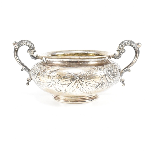 10 - A Georgian hallmarked silver sugar bowl. The George IV bowl having a circular plinth raising to a bu... 