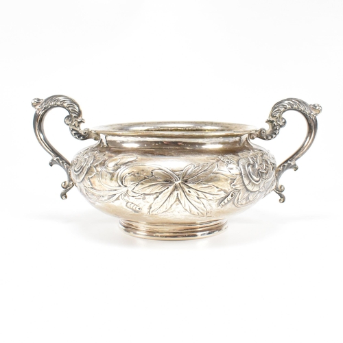 10 - A Georgian hallmarked silver sugar bowl. The George IV bowl having a circular plinth raising to a bu... 