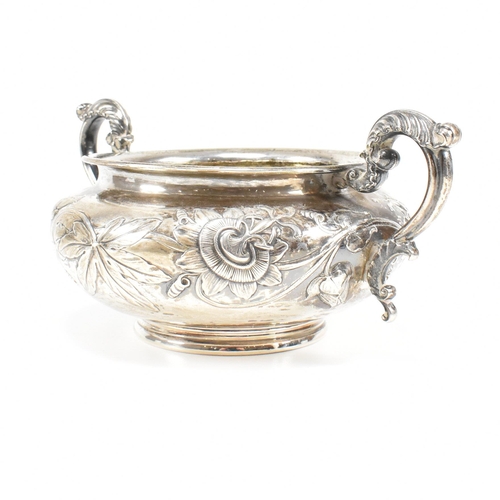 10 - A Georgian hallmarked silver sugar bowl. The George IV bowl having a circular plinth raising to a bu... 