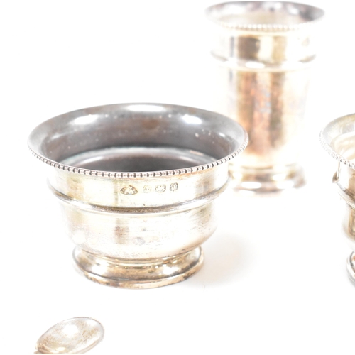 100 - A1930sÿhallmarked silver three piece condiment set. The set comprising of salt, cruet and condiment ... 