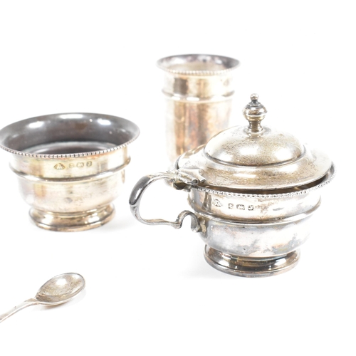 100 - A1930sÿhallmarked silver three piece condiment set. The set comprising of salt, cruet and condiment ... 