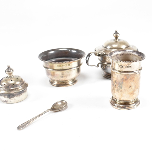 100 - A1930sÿhallmarked silver three piece condiment set. The set comprising of salt, cruet and condiment ... 