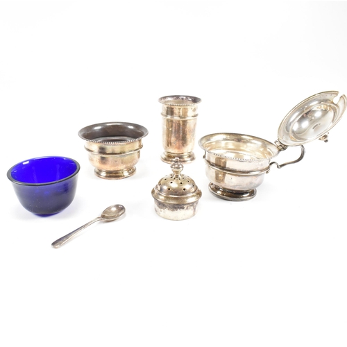 100 - A1930sÿhallmarked silver three piece condiment set. The set comprising of salt, cruet and condiment ... 