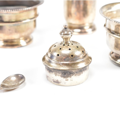 100 - A1930sÿhallmarked silver three piece condiment set. The set comprising of salt, cruet and condiment ... 