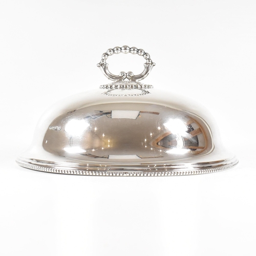 102 - A George V hallmarked silver plate cloche. The meat dome being of circular for with beaded rim risin... 