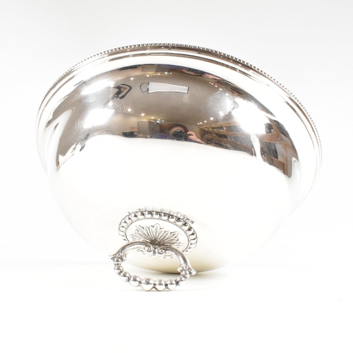 102 - A George V hallmarked silver plate cloche. The meat dome being of circular for with beaded rim risin... 