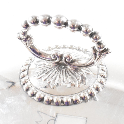 102 - A George V hallmarked silver plate cloche. The meat dome being of circular for with beaded rim risin... 