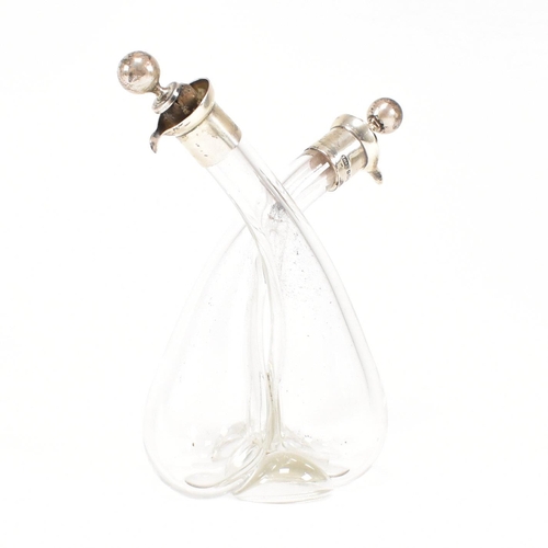 103 - A George V hallmarked silver mounted glass oil and vinegar bottle.ÿHallmarked for Birmingham, 1922. ... 