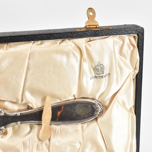 104 - A George V hallmarked silver and tortoiseshell mounted, cased vanity set. The six piece set to inclu... 