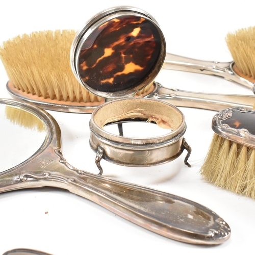 104 - A George V hallmarked silver and tortoiseshell mounted, cased vanity set. The six piece set to inclu... 