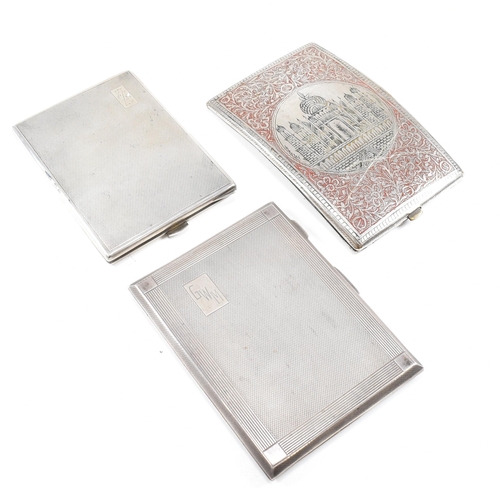 105 - Three cigarette cases. The lot to include a George VI hallmarked silver cigarette case. The case hav... 