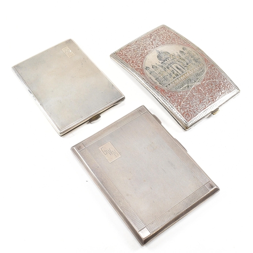 105 - Three cigarette cases. The lot to include a George VI hallmarked silver cigarette case. The case hav... 