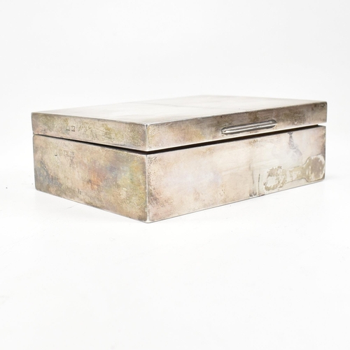 108 - An early 20th century hallmarked silver wood lined cigarette box. Hallmarks rubbed and only partiall... 