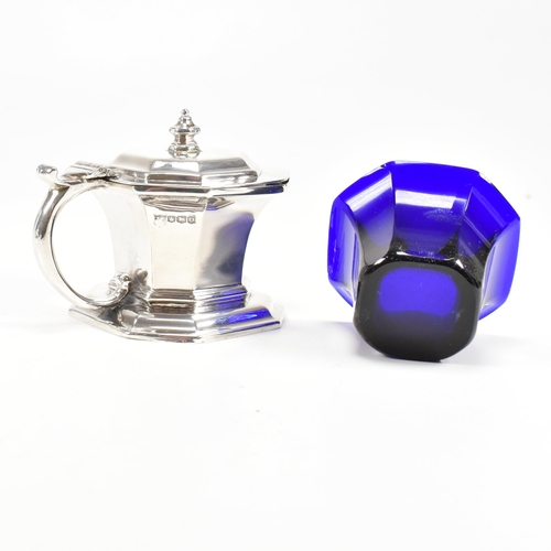 115 - A pair of Victorian hallmarked silver salts and later condiment pot. The salts having an octagonal s... 