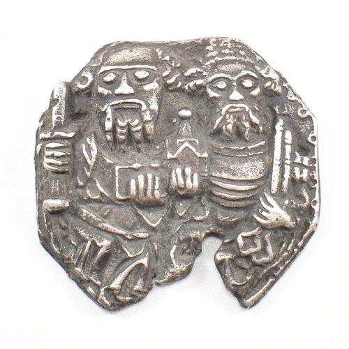 121 - A white metal pilgrims' token. The token depicting an image of Saint Peter and Saint Paul cast in re... 