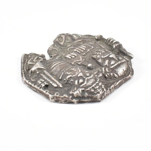 121 - A white metal pilgrims' token. The token depicting an image of Saint Peter and Saint Paul cast in re... 