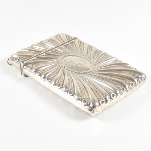 122 - A silver hallmarked card case. The case having a hinged lid and central monogrammed cartouche. hallm... 