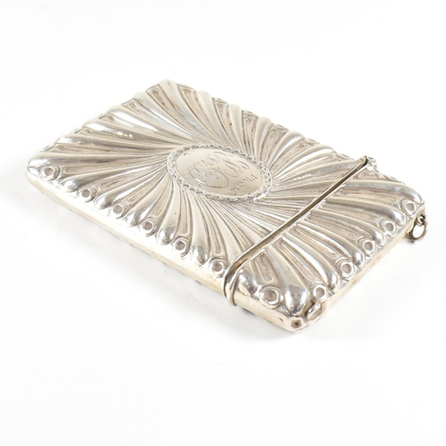 122 - A silver hallmarked card case. The case having a hinged lid and central monogrammed cartouche. hallm... 