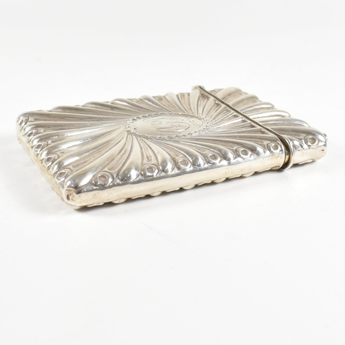 122 - A silver hallmarked card case. The case having a hinged lid and central monogrammed cartouche. hallm... 