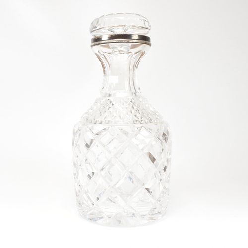 123 - A George VI hallmarked silver collared cut glass decanter. Hallmarked for London, 1936.The decanter ... 