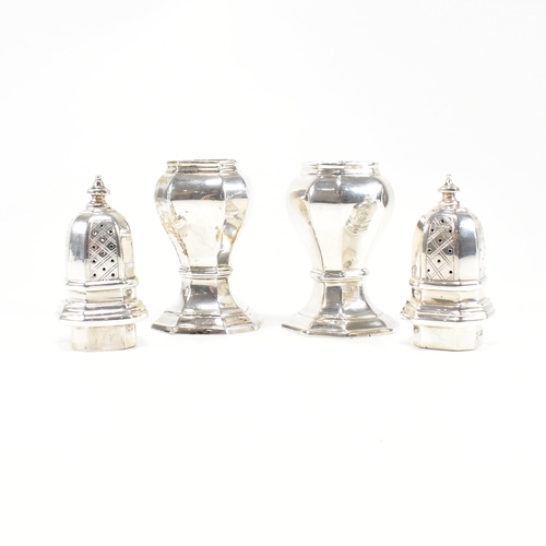 126 - A pair of hallmarked silver cruets. The pepper shakers having an octagonal shape plinth base and bei... 