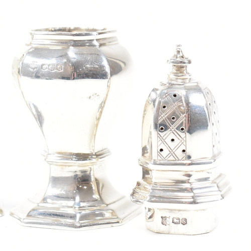 126 - A pair of hallmarked silver cruets. The pepper shakers having an octagonal shape plinth base and bei... 