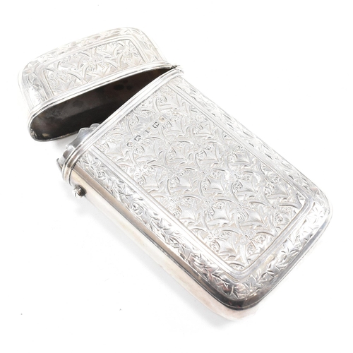 128 - A Victorian hallmarked silver cigar case. The case having an etched foliate design to body with cent... 