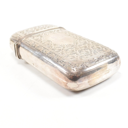 128 - A Victorian hallmarked silver cigar case. The case having an etched foliate design to body with cent... 