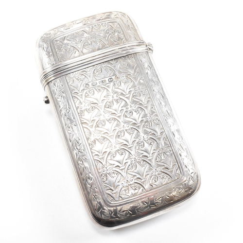 128 - A Victorian hallmarked silver cigar case. The case having an etched foliate design to body with cent... 