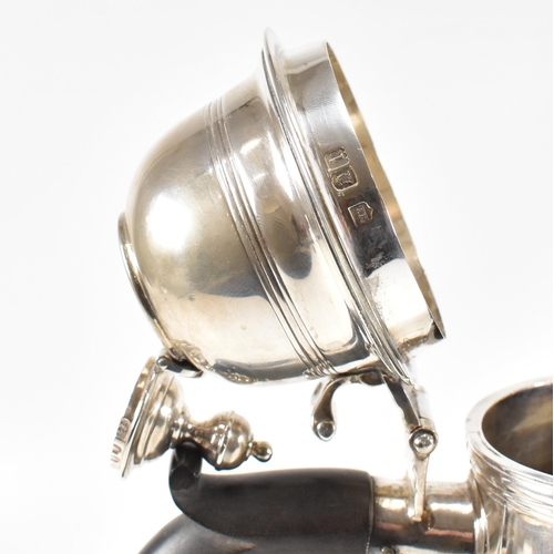 129 - An Edwardian hallmarked Britannia silver coffee pot. The Edward VII pot having a hinged lid, finial ... 