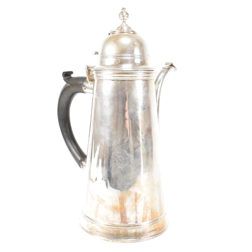 129 - An Edwardian hallmarked Britannia silver coffee pot. The Edward VII pot having a hinged lid, finial ... 