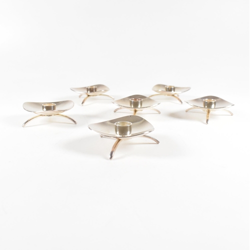 13 - A set of six Danish Mid Centuryÿsilver plated candlestick holders. The set each being marked Cohr De... 