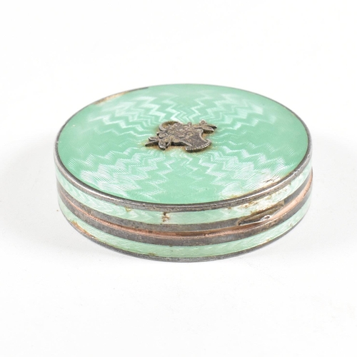 134 - A 1920s hallmarked silver and guilloche enamel compact. The compact having import marks for London 1... 