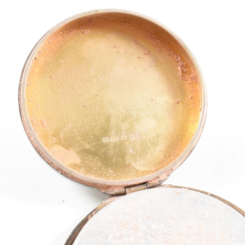 134 - A 1920s hallmarked silver and guilloche enamel compact. The compact having import marks for London 1... 