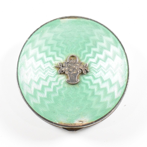 134 - A 1920s hallmarked silver and guilloche enamel compact. The compact having import marks for London 1... 