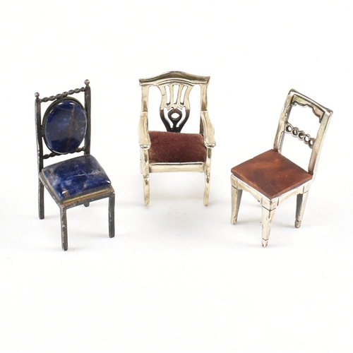 135 - Threeÿ Italian white metal and silver dolls house chairs. The chairs to include two Italian marked 9... 