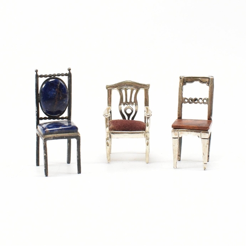 135 - Threeÿ Italian white metal and silver dolls house chairs. The chairs to include two Italian marked 9... 