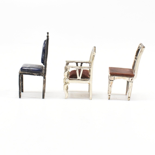 135 - Threeÿ Italian white metal and silver dolls house chairs. The chairs to include two Italian marked 9... 