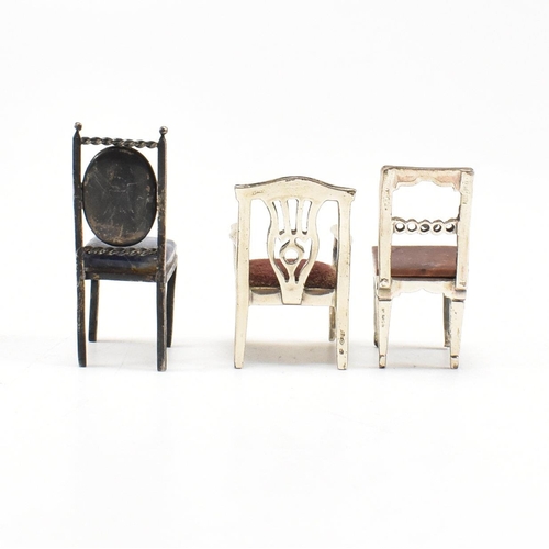 135 - Threeÿ Italian white metal and silver dolls house chairs. The chairs to include two Italian marked 9... 