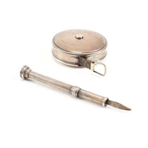 137 - A hallmarked Sampson and Mordan / J Rabone & Sons silver cased tape measure and a silver plated toot... 